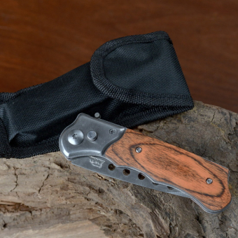 Нож складной в чехле под дерево с круглыми прорезями